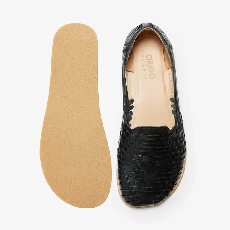 Pair of Origo Women's Huarache Slip-On Wide Sandals By Anya in black, sole and top view.