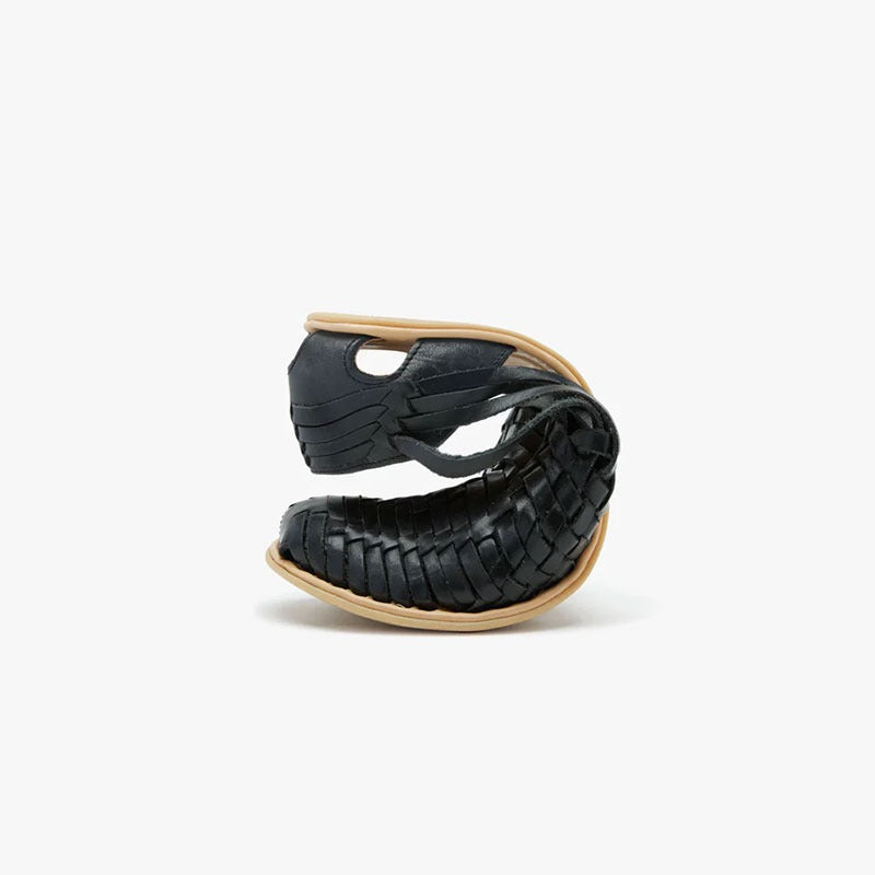 Origo Women's Huarache Slip-On Wide Sandal By Anya in black, scrunched up.