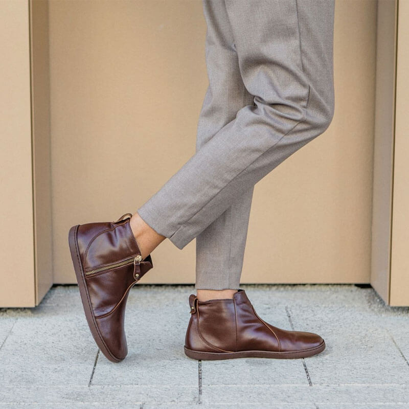 Person wearing Shapen Women's Ivy 2.0 Ankle Boots - Brown, inner and outer side view.