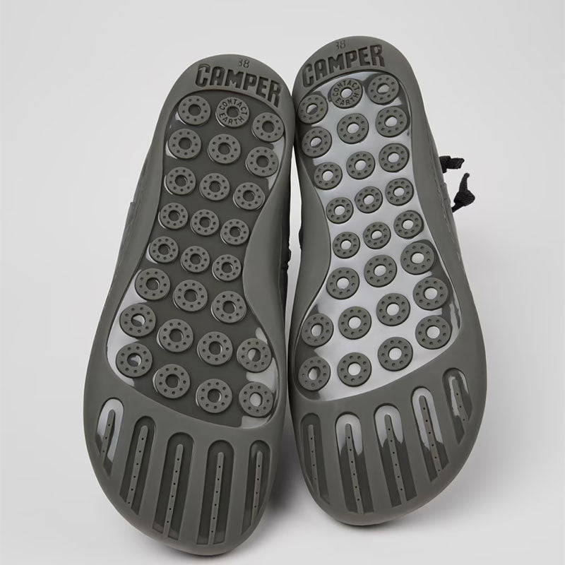 Pair of Camper Women's Peu Ankle Boots in grey, sole view.