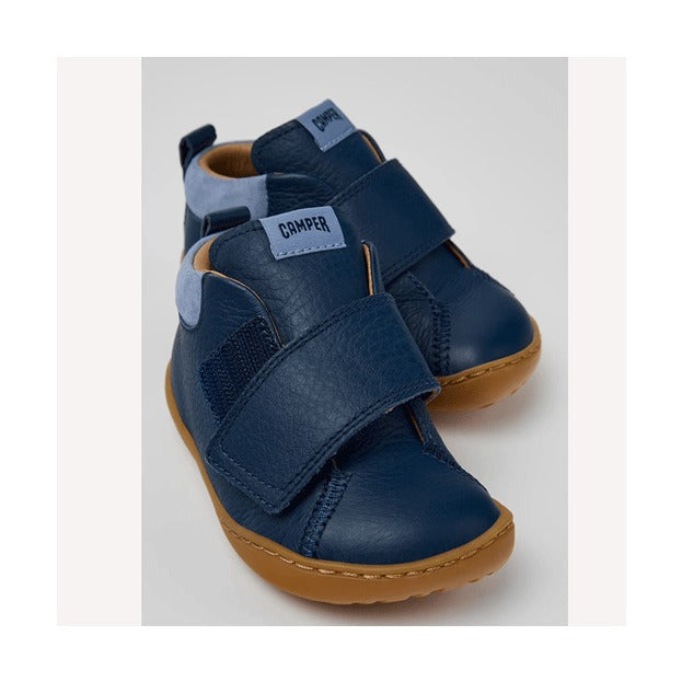 Pair of Camper Kids First Walker Peu Leather Ankle Boots in blue, angled view showing outer side, front and velcro strap.