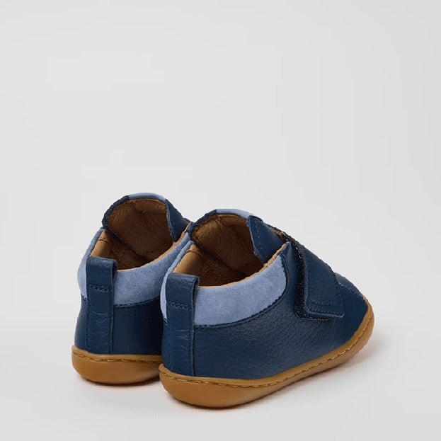 Pair of Camper Kids First Walker Peu Leather Ankle Boots in blue, angled view showing outer side and rear.