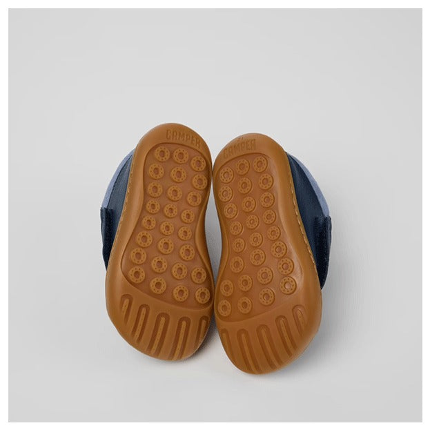 Pair of Camper Kids First Walker Peu Leather Ankle Boots in blue, sole view.