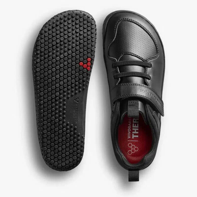 Pair of Vivobarefoot Kids Vegan School Shoes Ludo - Obsidian, one showing the sole view and the other showing the top view.