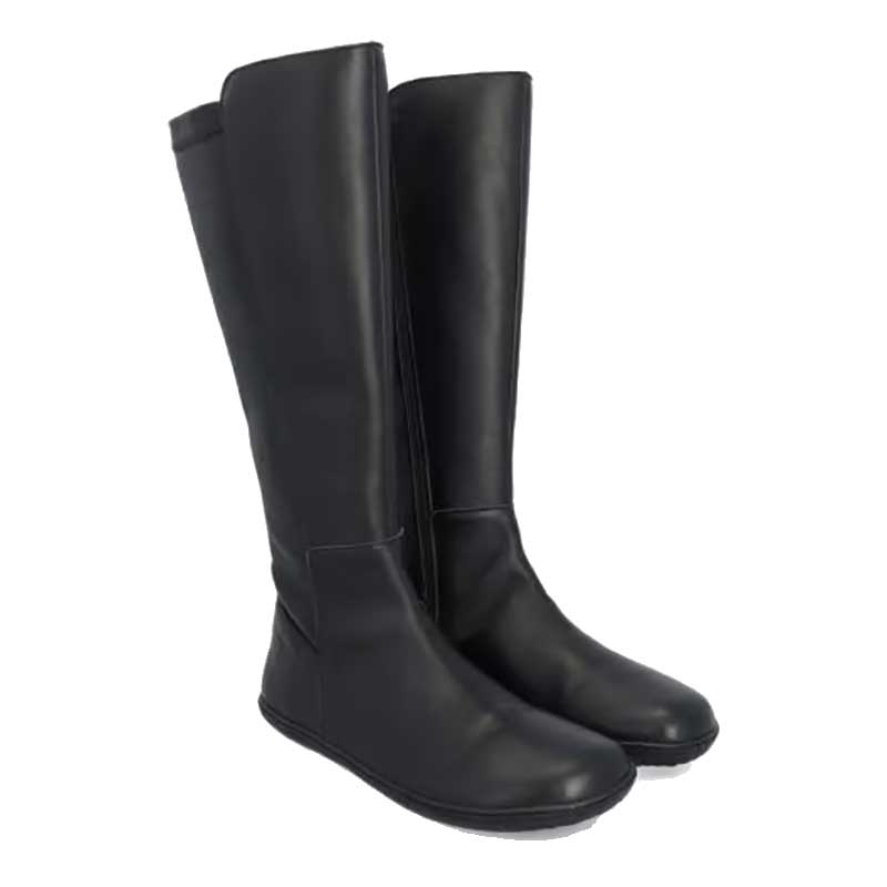 Pair of Groundies Women's Mona Stretch Boots in black, angled view showing outer side and front.