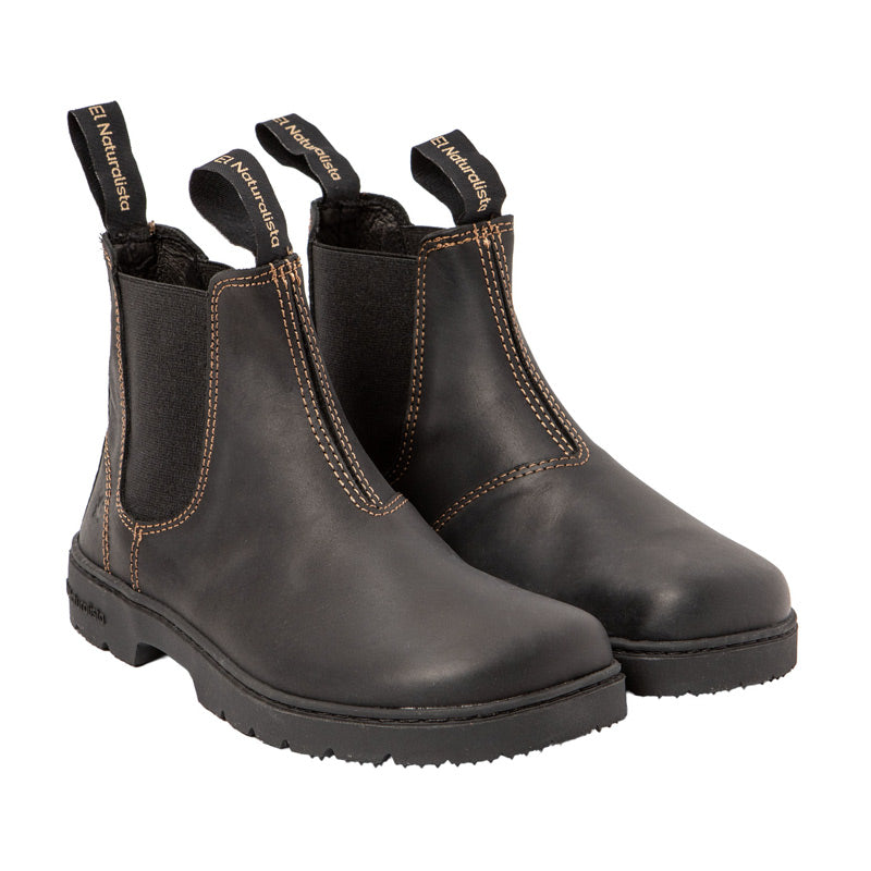 Pair of El Naturalista Barefoot Arizona Nomada Chelsea Boots - Black, angled view showing outer side and front.