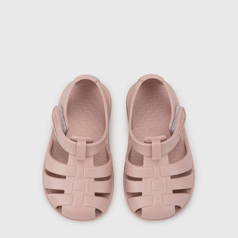 Pair of Igor Nemo Jelly Shoes in soft pink, top view.