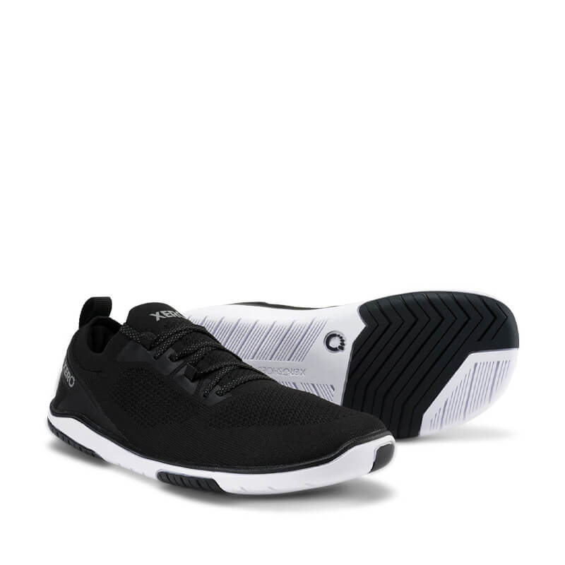 Pair of Xero Women's Shoes Nexus Knit - Black, one angled showing the outer side and front view and the other showing the sole view.