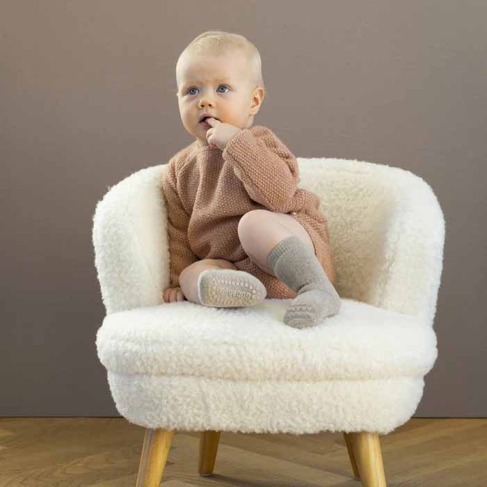 Child wearing Go Baby Go Non-Slip Organic Cotton Socks in sand.