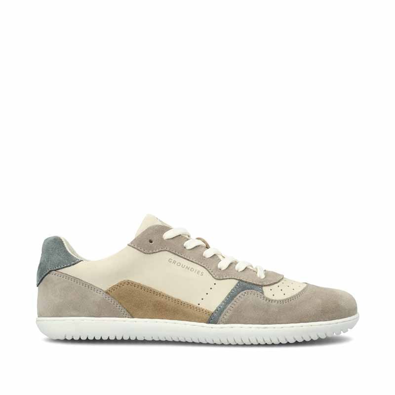 Groundies Adults Nova GO1 Trainer in beige and green, outer side view.