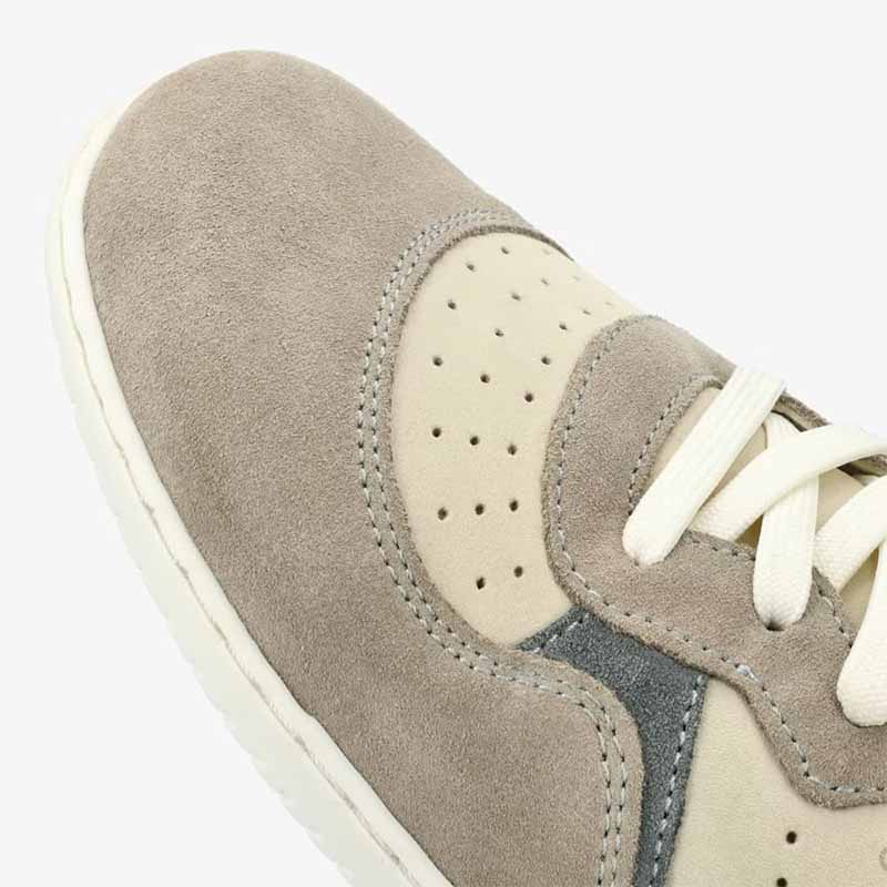 Groundies Adults Nova GO1 Trainer in beige and green, close up of toe box.