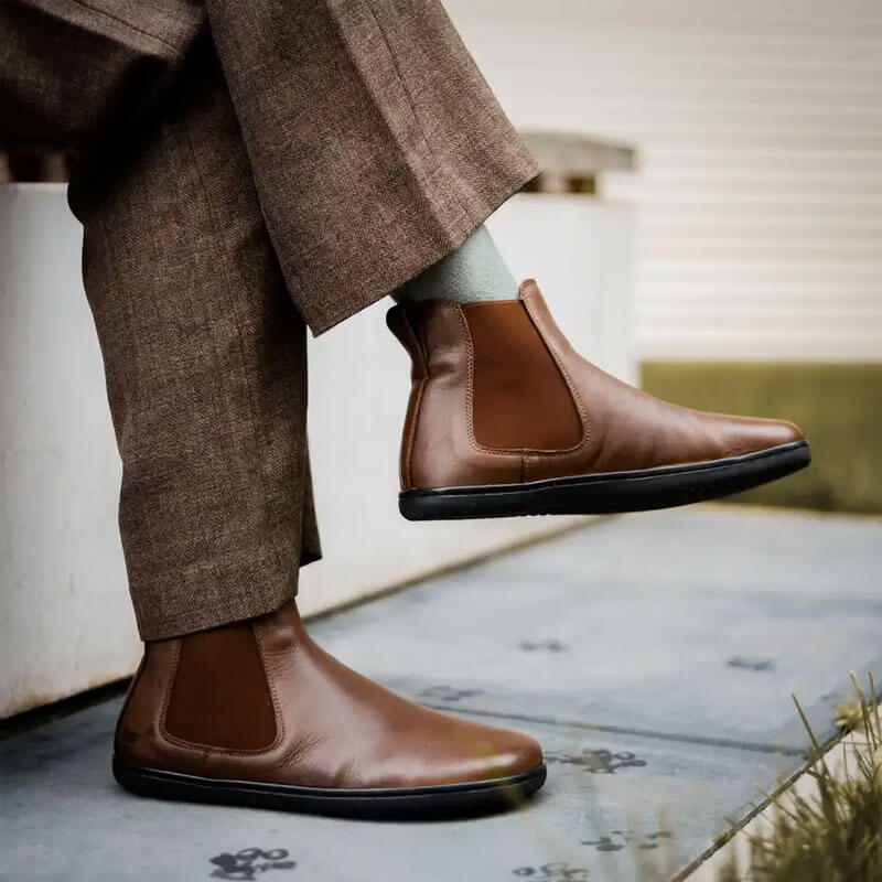 Person wearing Angles Women's Chelsea Boots NYX - Brown with brown trousers