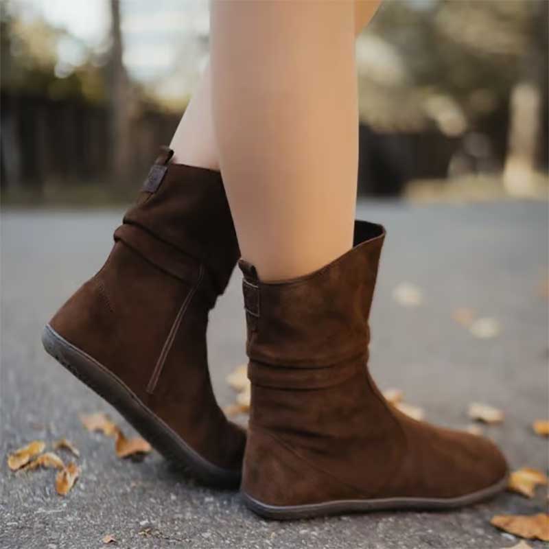 Person wearing Groundies Women's Odessa GO1 Boot in dark brown.