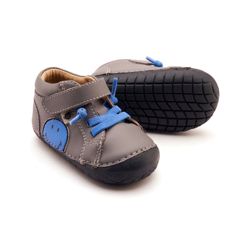 Pair of Old Soles Smiley Pave Shadow Boots - Neon Blue, one angled showing outer side and front, the other on it's side showing the sole.