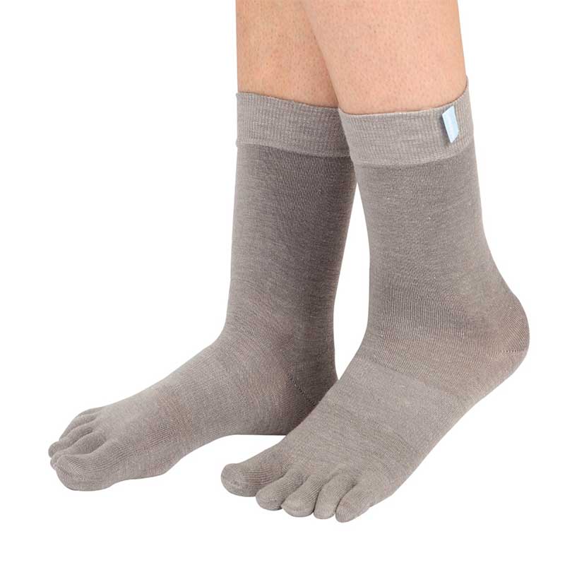 Person wearing TOTETOE Adults Outdoor Wool Mid-Calf Toe Socks - Grey.