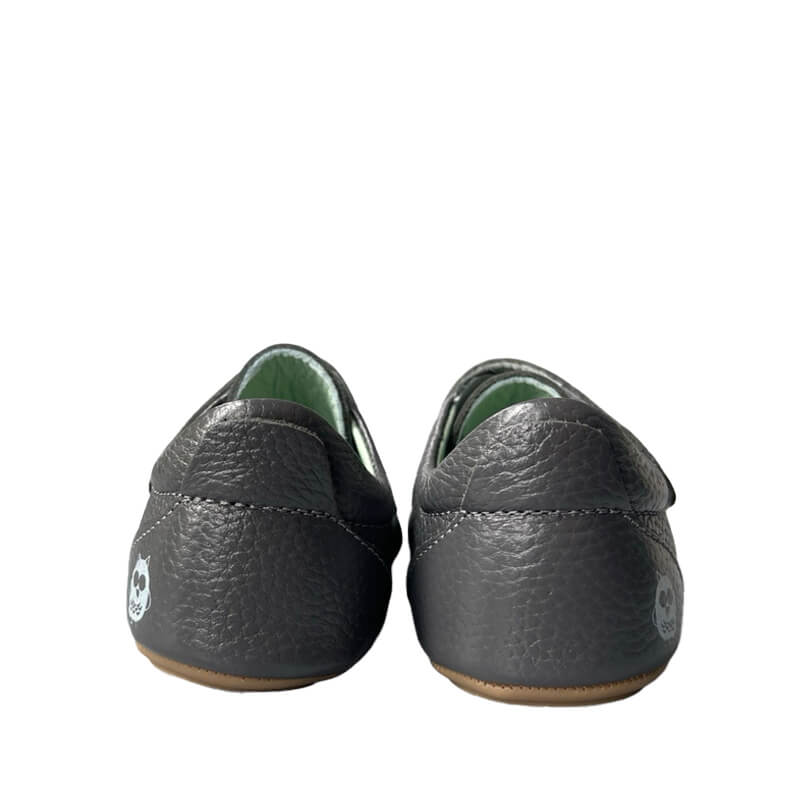 Pair of Poco Nido Kids Strap Shoes - Grey, rear view.