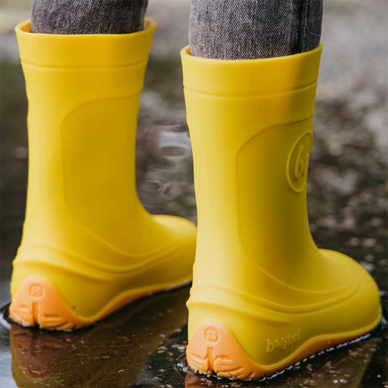 Person wearing Be Lenka Kids Wellies Pudds - Yellow, rear view