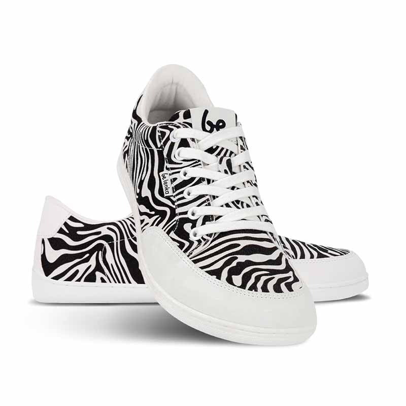 Pair of Be Lenka Adults Trainers Rebound - Zebra, one angled and leaning showing the outer side, the other partially showing the inner side