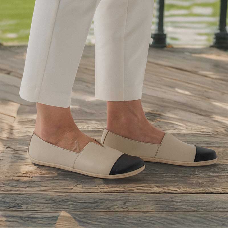Person wearing Be Lenka Women's Moccasins Rosaluna - Beige and Black, inner and outer side view
