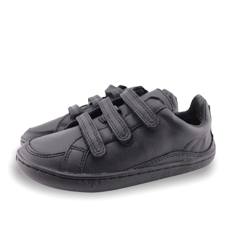 Pair of PaperKrane Kids Ruler Shoes in black, angled view showing outer side.