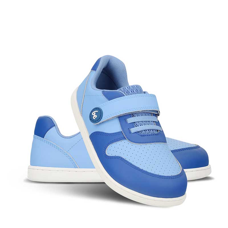 Pair of Be Lenka Kids Trainers Scoot - Blue, one angled and leaning showing the outer side, the other partially showing the inner side