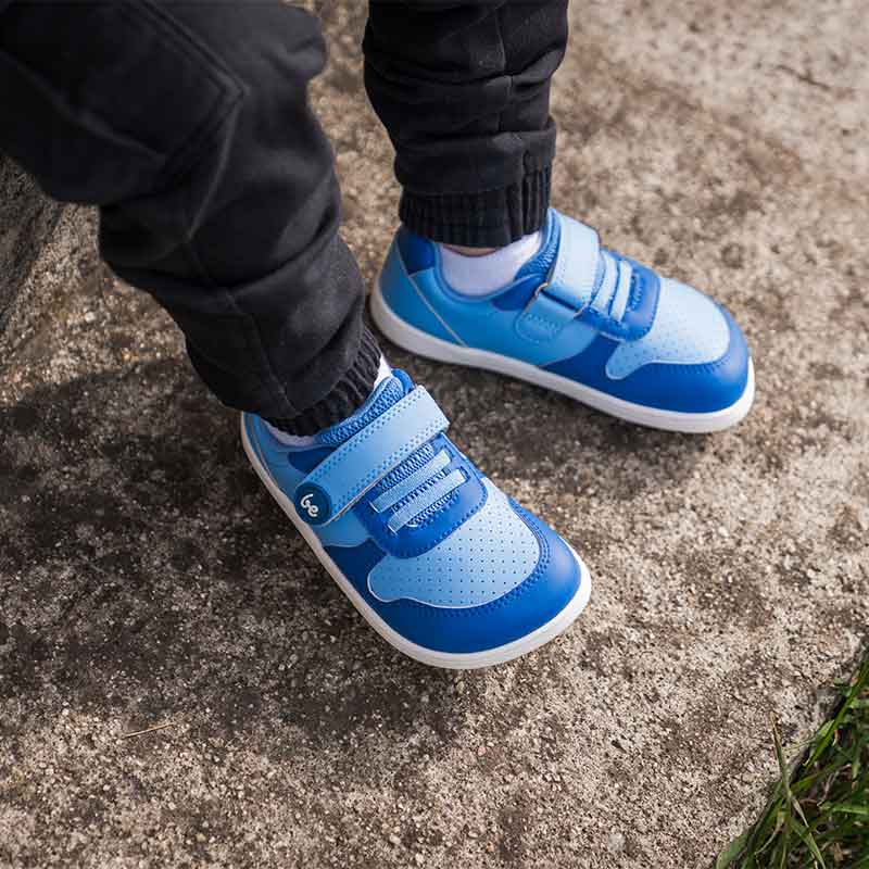 Person wearing Be Lenka Kids Trainers Scoot - Blue with black trousers