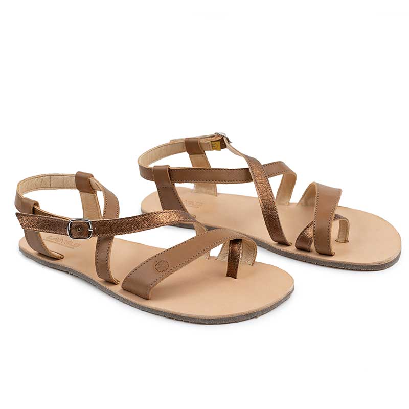 Pair of Tikki Women's Sandals Selene - Camel, angled view showing outer side and front.