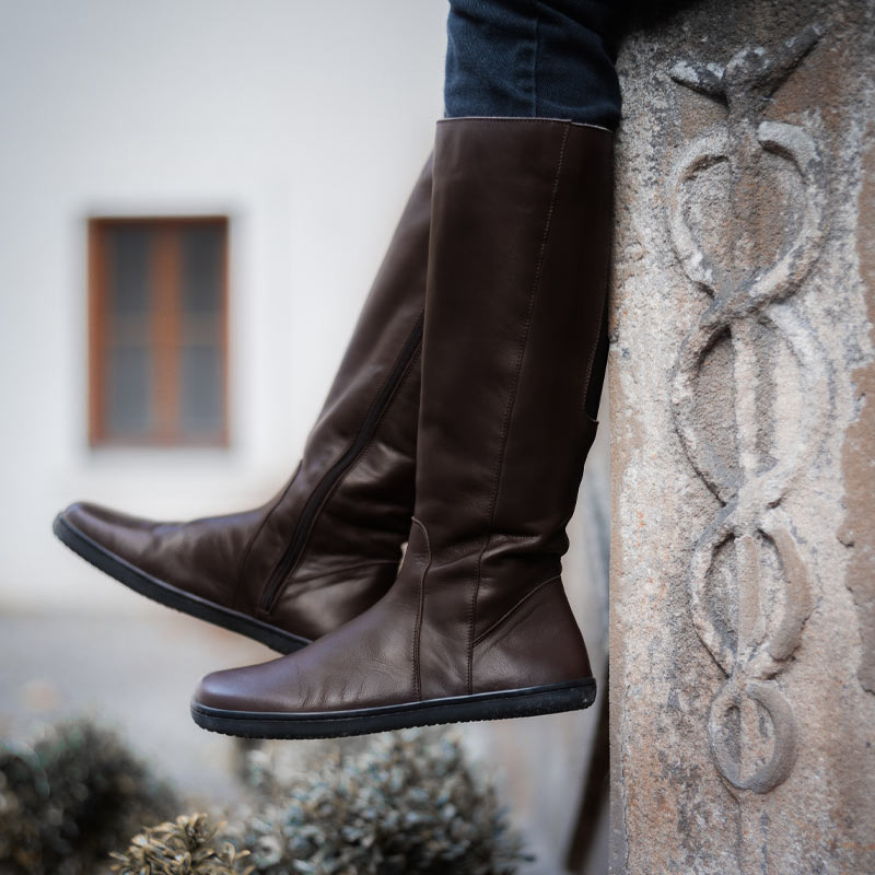 Person wearing Angles Women's Tall Boots Thalia - Nut with blue jeans