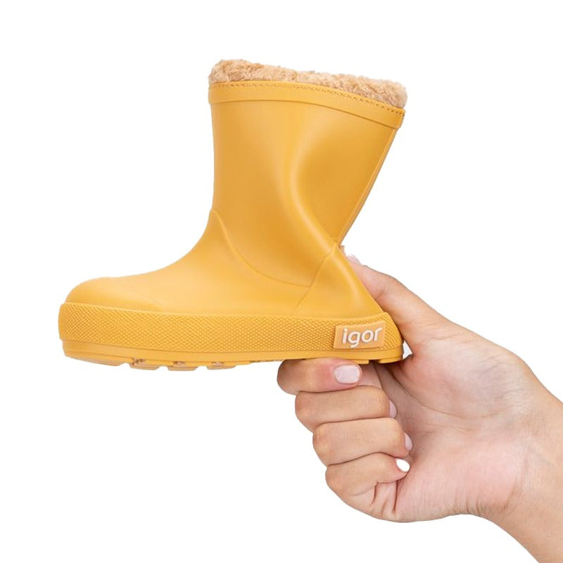 Person holding Igor Yogi Barefoot Warm Wellington Boot - Amarillo Yellow.