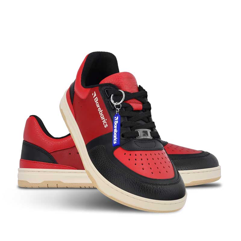 Pair of Be Lenka Adults Barebarics Trainers Wave - Black and Red, one angled and leaning showing the outer side and Barebarics keyring, the other partially showing the inner side