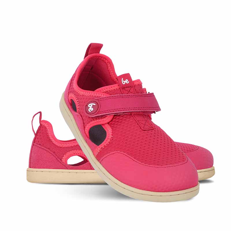 Pair of Be Lenka Kids Sandals Zest - Berry, one angled and leaning showing the outer side, the other partially showing the inner side