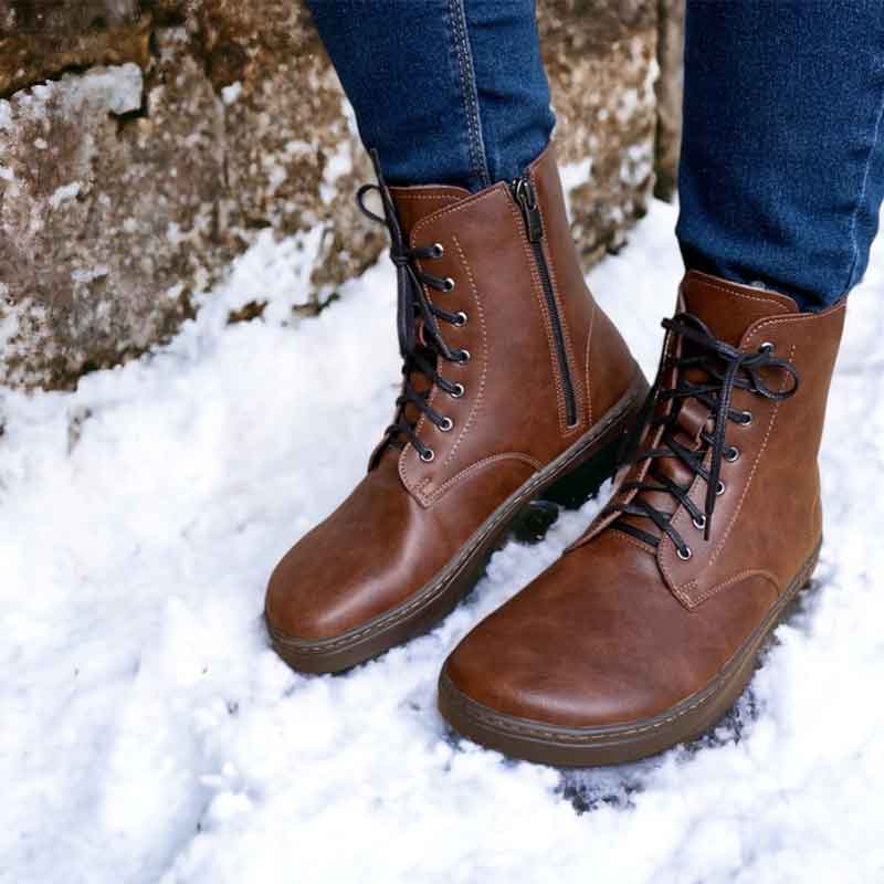 Person wearing Peerko Adults Vegan Zipper Boots - Nut with jeans.